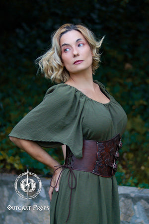 Woman wearing a green dress with a brown belt against a natural background. Elegant Floral Underbust Leather Corset - Handcrafted Rose Design for Larp, Reinassande Faire &amp; Cosplay