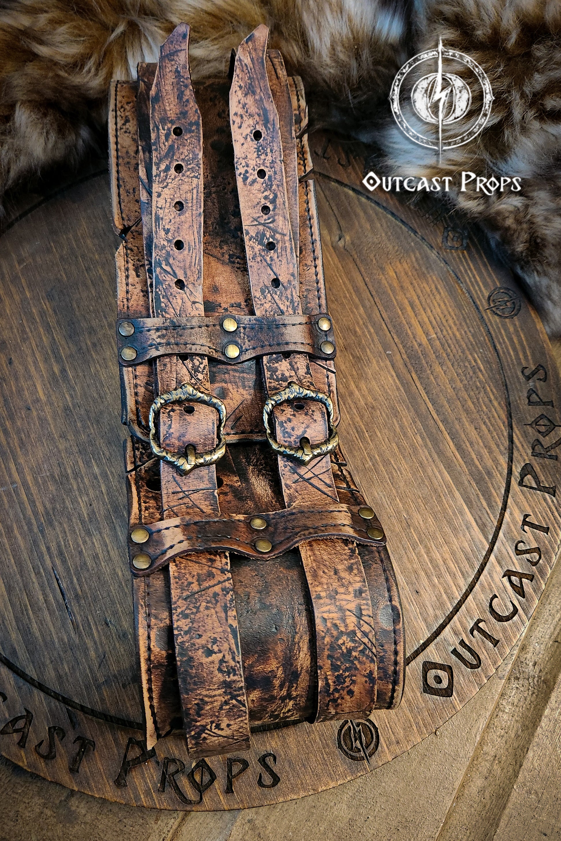 Black doble leather broadbelt with silver buckles on a wooden surface with 'Outcast Props' branding. Veteran Leather Belt. Medieval leather belt. Orc belt. Warrior belt for larp.