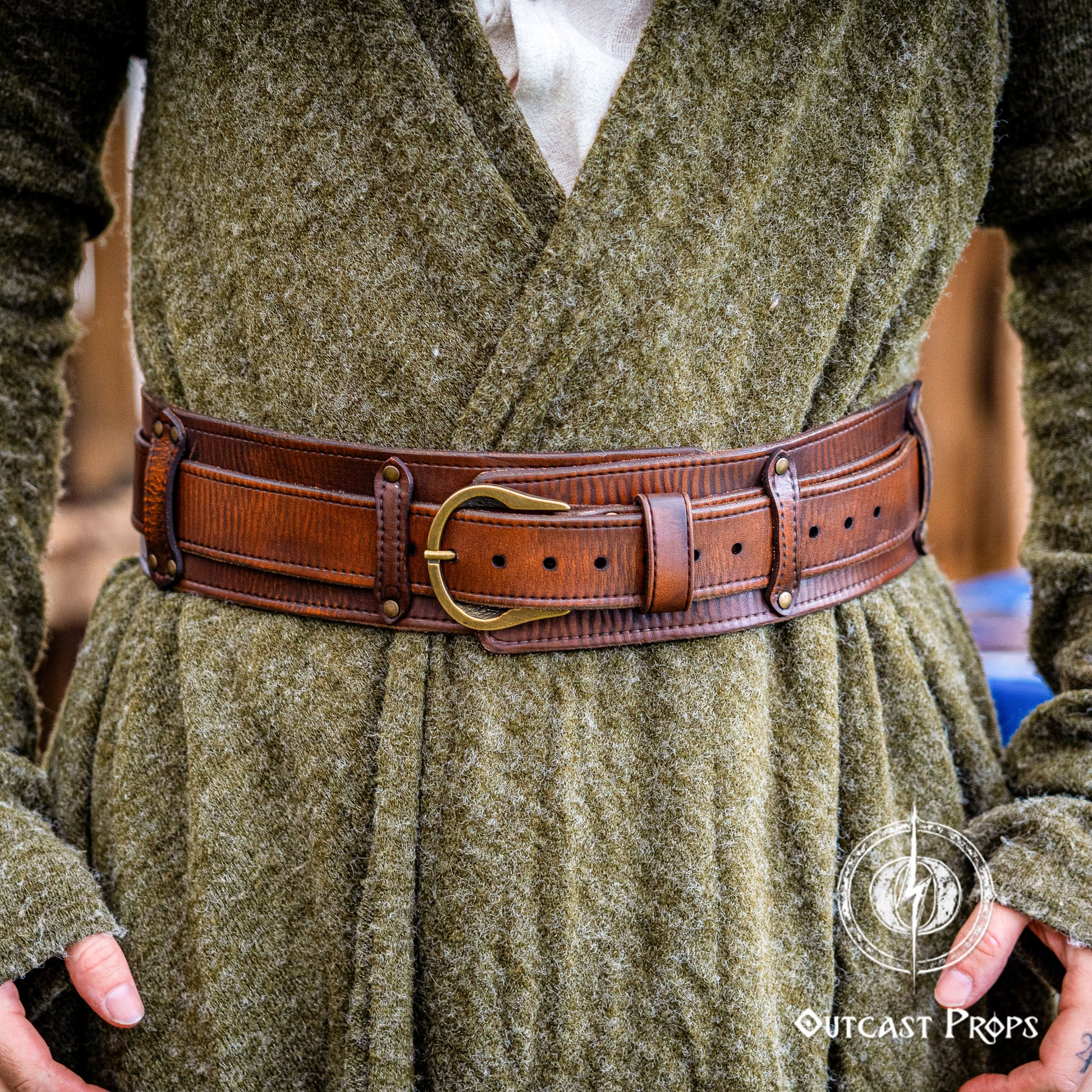 Person wearing a green robe with a brown belt and Outcast Props logo. Celtic knot leather belt silver buckle larp belt for ren fair fantasy costume celtic belt unisex leather belt for renaissance outfit