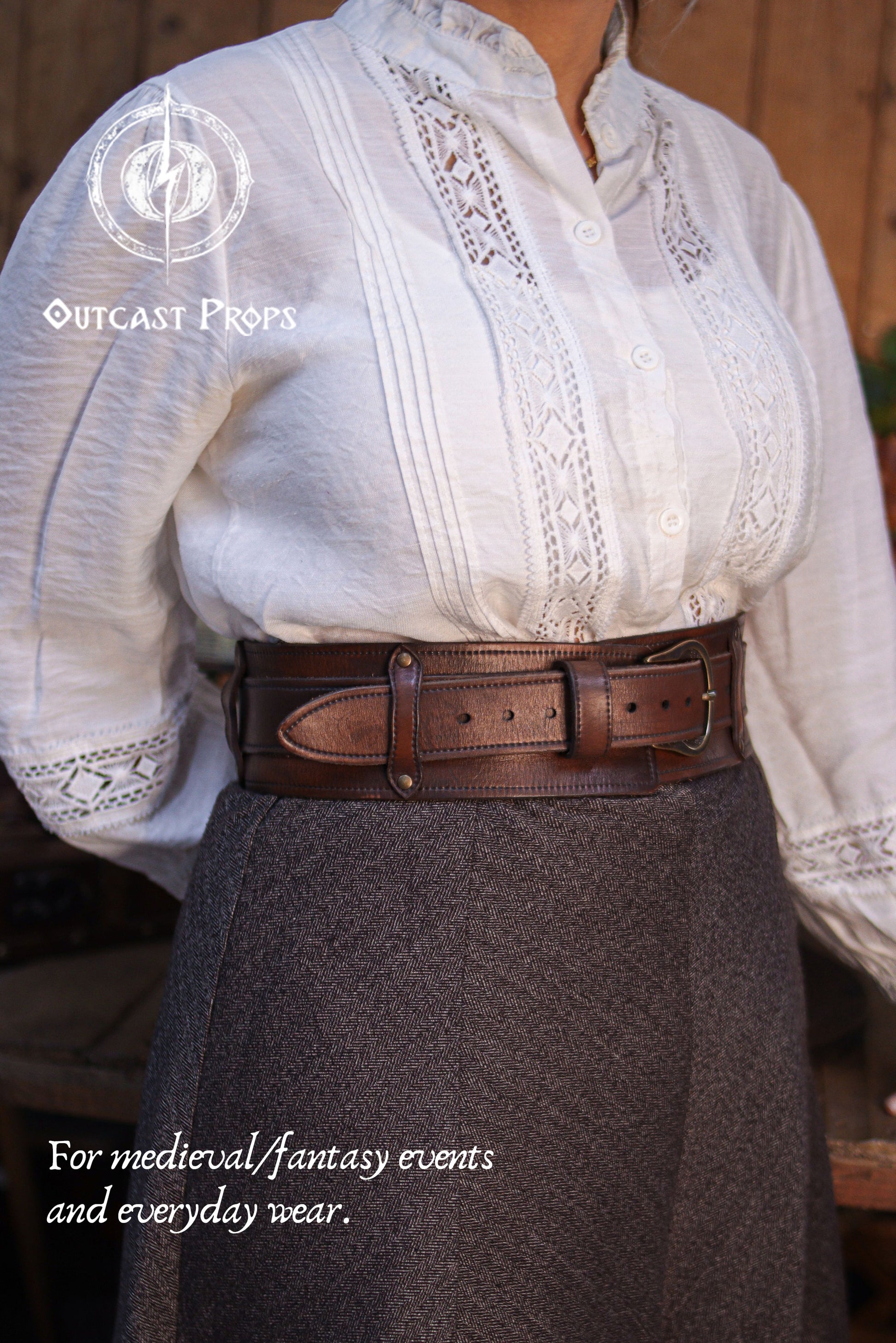 Angled front view of the Handcrafted Leather Wanderer Belt worn at the waist, showing the wide leather frame and brass buckle from a different perspective. The premium vegetable-tanned leather features visible grain, hand-finished edges, and subtle aging. A modular two-piece belt designed to suit medieval, fantasy, and LARP costumes while remaining refined enough for modern everyday wear. 