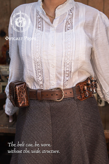 Front view of the Handcrafted Leather Wanderer Belt worn without the wide structure, styled with leather pouches attached to the inner belt. The slimmer configuration highlights the brass buckle, adjustment holes, and smooth vegetable-tanned leather finish. This two-in-one modular leather belt adapts from LARP, Renaissance fairs, and medieval cosplay to practical daily wear, offering versatility for adventurer and fantasy character outfits.