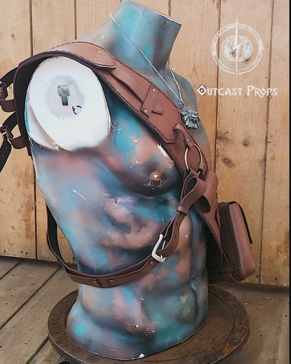 Witcher 3 ursine leather baldric displayed on painted bust with wolf medallion. Features iconic metal ring and pouch design. Perfect leather baldric for Witcher cosplay, Geralt costume, LARP armor builds, bear school armor, and fantasy RPG witcher gear.