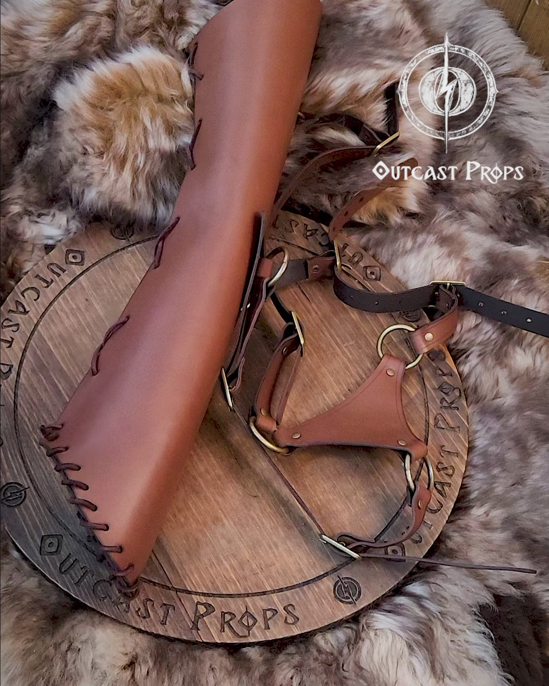 Close-up of a handcrafted leather quiver with full adjustable harness, resting on a wooden disc with fur in the background. The brown leather and brass buckles showcase the artisan quality. Ideal for archery quiver setups, larp quiver wear, cosplay, or medieval reenactment. A beautiful choice for fans of leather quiver and bow and arrow props. Durable, stylish and fantasy-ready.