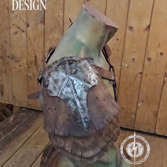 Front view of the new Outcast Props design showing the complete double pauldron armor with crossed chest harness. The layered aged brown leather and hammered steel plates blend Viking, barbarian, and ork aesthetics. Each shoulder piece connects to the adjustable harness straps, creating a durable LARP and cosplay armor handcrafted with cinematic aging and detailed craftsmanship. Barbarian Leather and Metal Pauldron Set for LARP Viking Warrior or Ork Cosplay Armor Shoulder Pads Post Apocalyptic