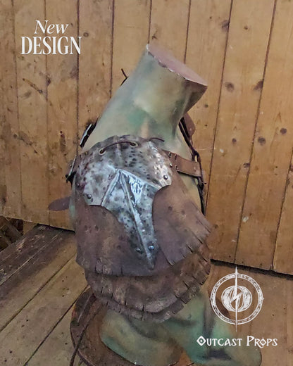 Front view of the new Outcast Props design showing the complete double pauldron armor with crossed chest harness. The layered aged brown leather and hammered steel plates blend Viking, barbarian, and ork aesthetics. Each shoulder piece connects to the adjustable harness straps, creating a durable LARP and cosplay armor handcrafted with cinematic aging and detailed craftsmanship. Barbarian Leather and Metal Pauldron Set for LARP Viking Warrior or Ork Cosplay Armor Shoulder Pads Post Apocalyptic