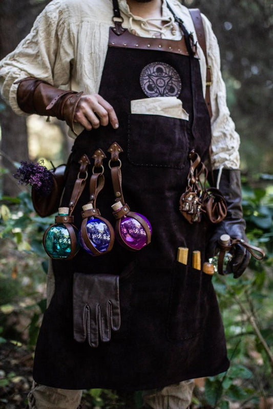 A person wearing a brown leather apron with pockets and a potion holder with glass bottles. Leather Apron, larp Alchemy steampunk crazy scientist mechanics, engineers. With accesories and pockets perfect for Barber