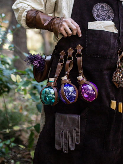 A person wearing a brown leather apron with pockets and a potion holder with glass bottles. Leather Apron, larp Alchemy steampunk crazy scientist mechanics, engineers. With accesories and pockets perfect for Barber