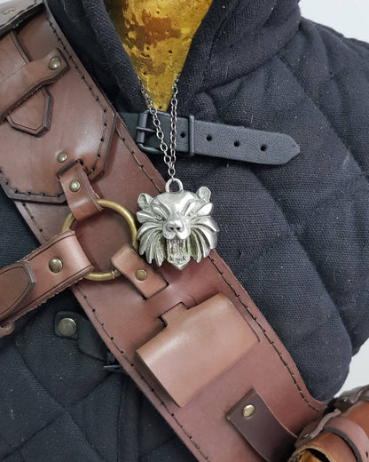Close-up of Witcher 3 ursine baldric wolf medallion and pouch detail. Crafted for immersive Witcher cosplay, leather baldric accessory for Geralt costume, LARP armor, fantasy monster hunter builds and medieval leather gear fans.